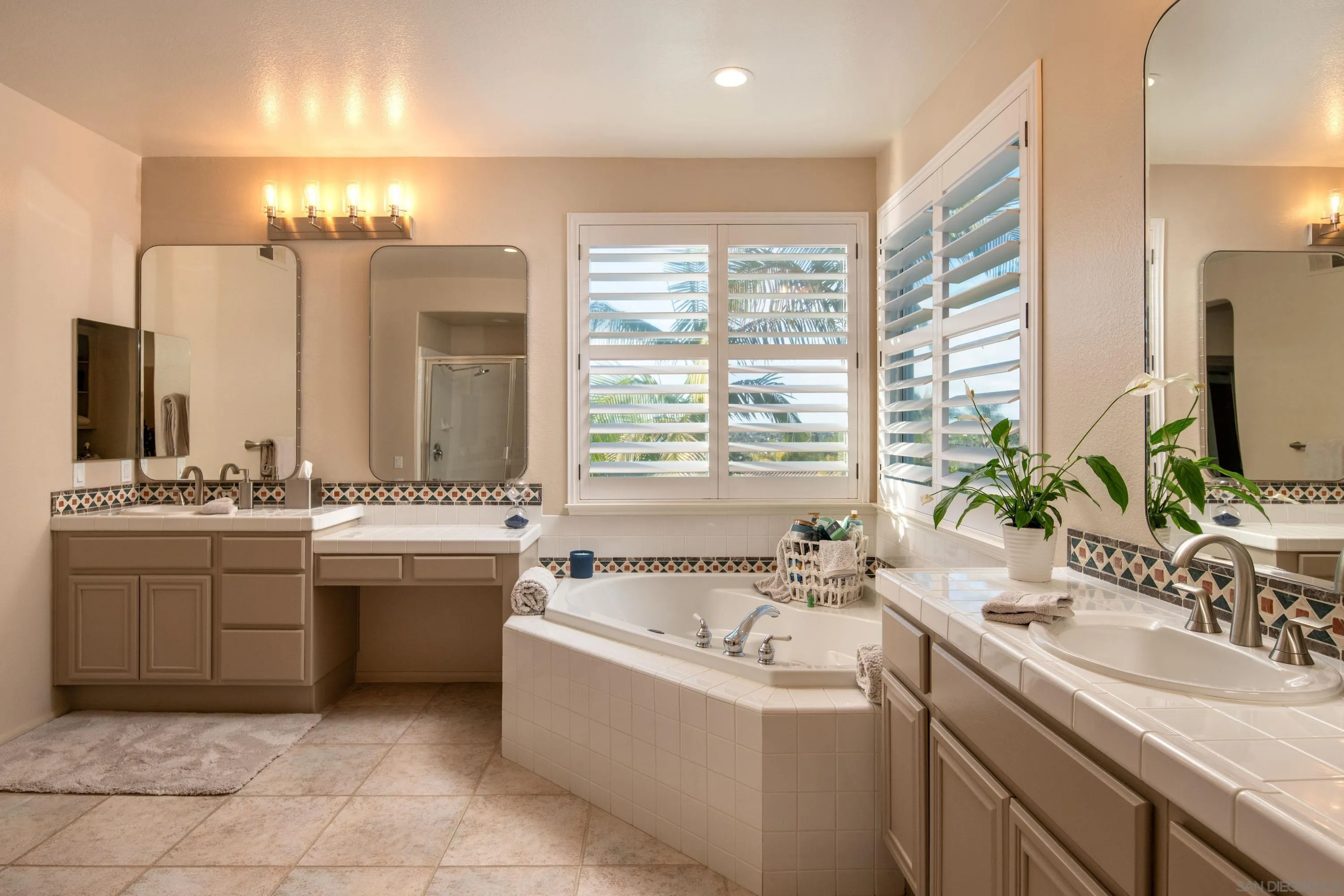 3476 Corte Sonrisa Carlsbad, CA 92009 - Photo 24 of 45 a bathroom with a granite countertop sink and a mirror