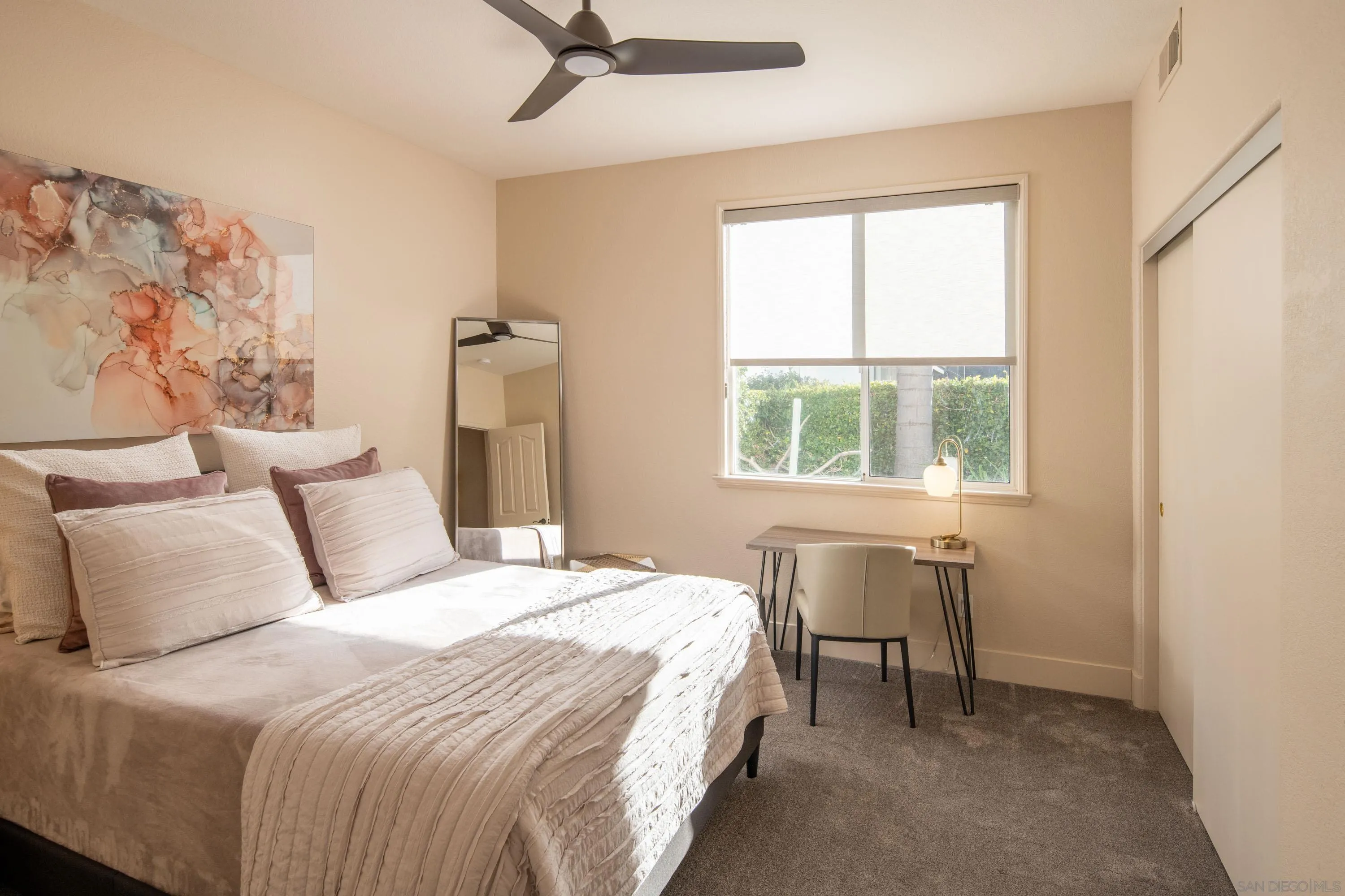 3476 Corte Sonrisa Carlsbad, CA 92009 - Photo 28 of 45 a bedroom with a bed and a window