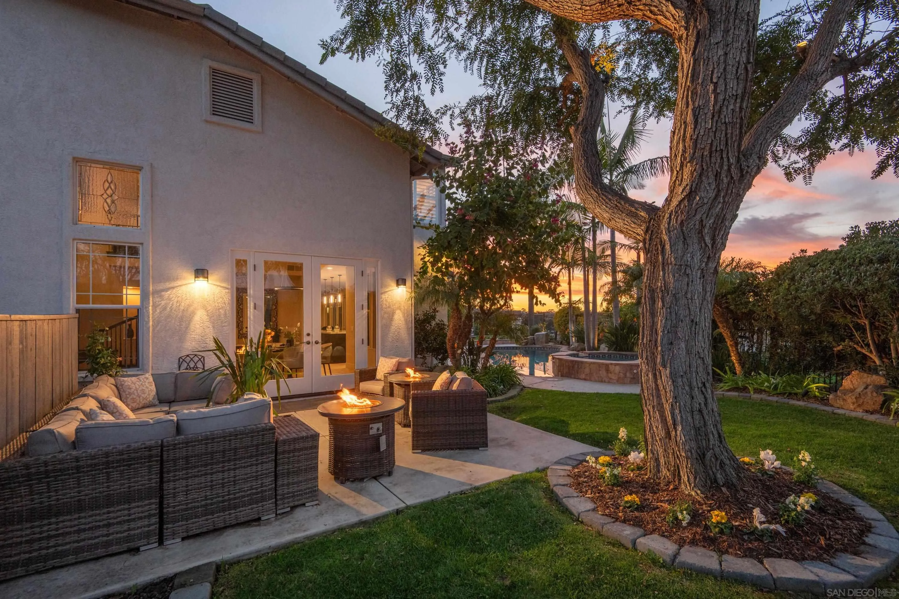 3476 Corte Sonrisa Carlsbad, CA 92009 - Photo 4 of 45 a view of a patio with couches plants and a big yard