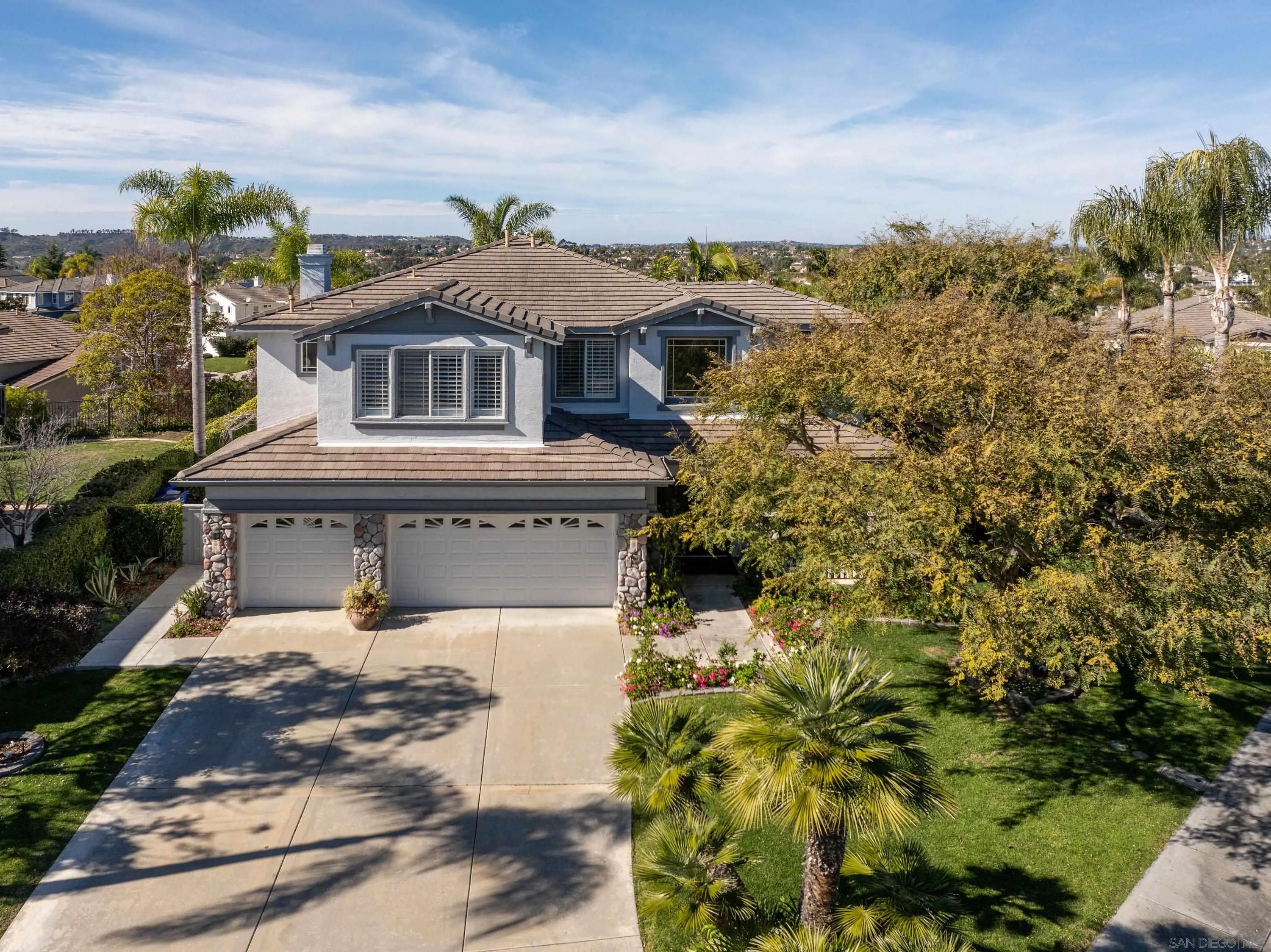 3476 Corte Sonrisa Carlsbad, CA 92009 - Photo 41 of 45 a front view of a house with a yard