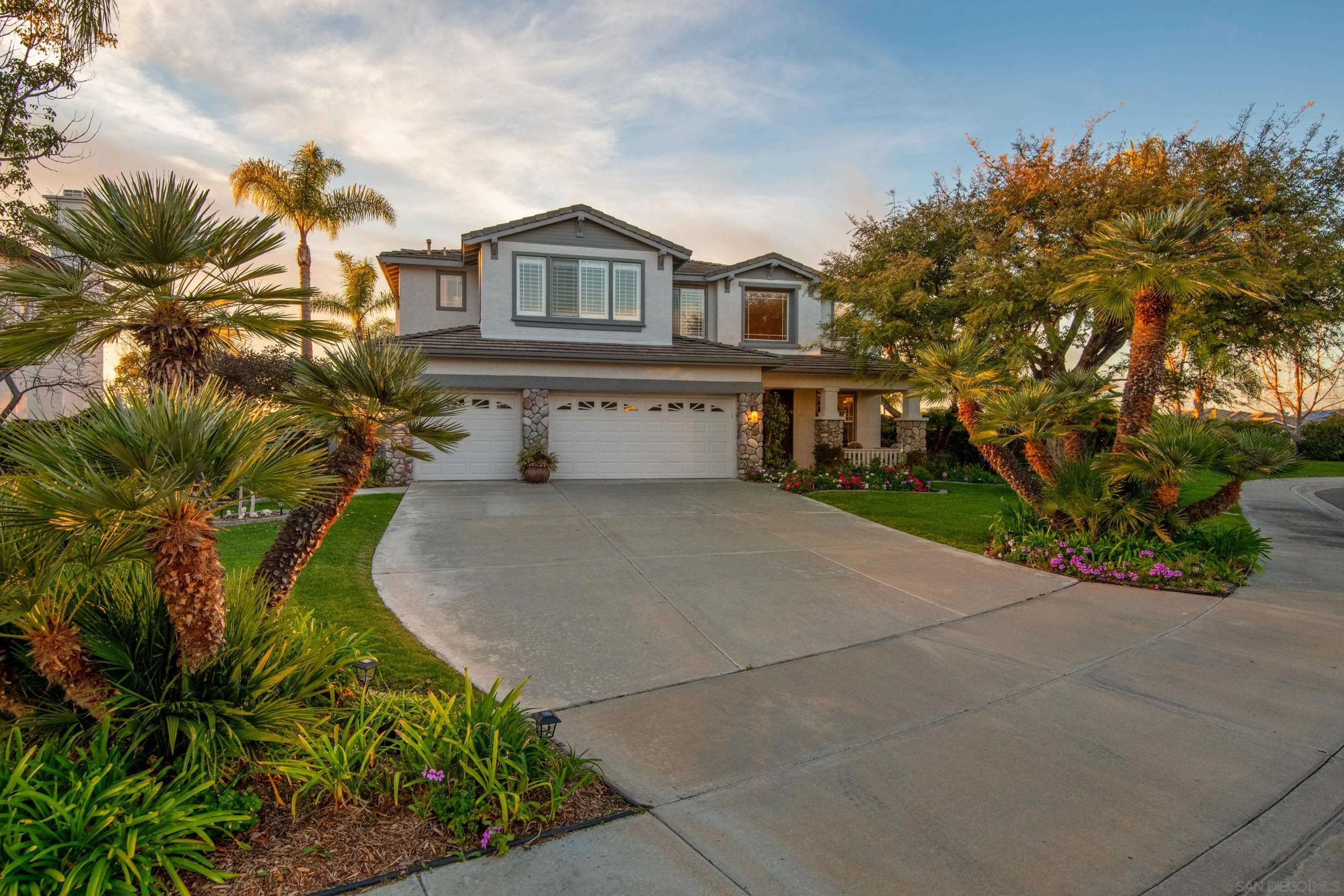3476 Corte Sonrisa Carlsbad, CA 92009 - Photo 44 of 45 a front view of a house with a yard and garage
