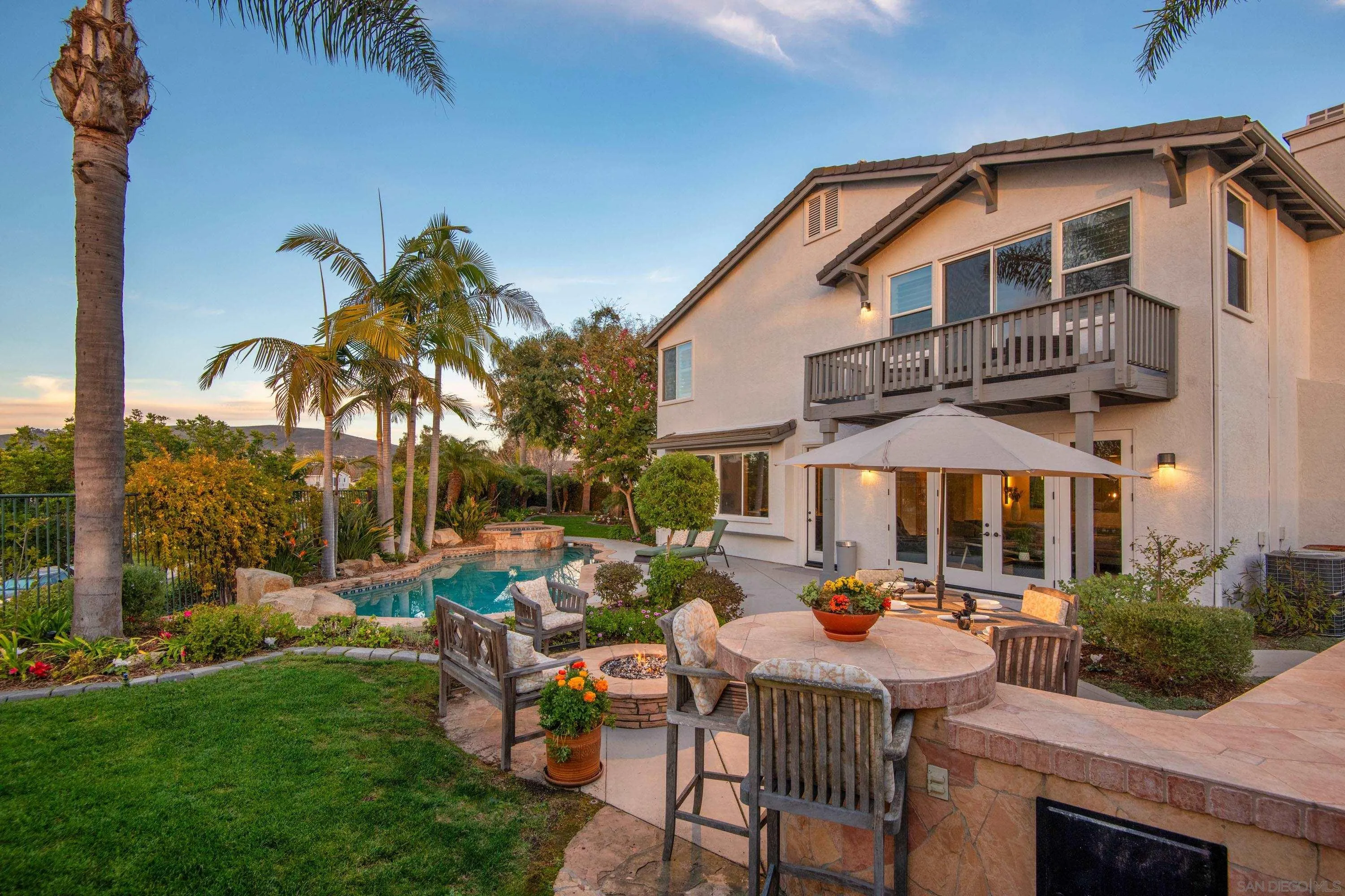 3476 Corte Sonrisa Carlsbad, CA 92009 - Photo 45 of 45 a front view of a house with garden and sitting area