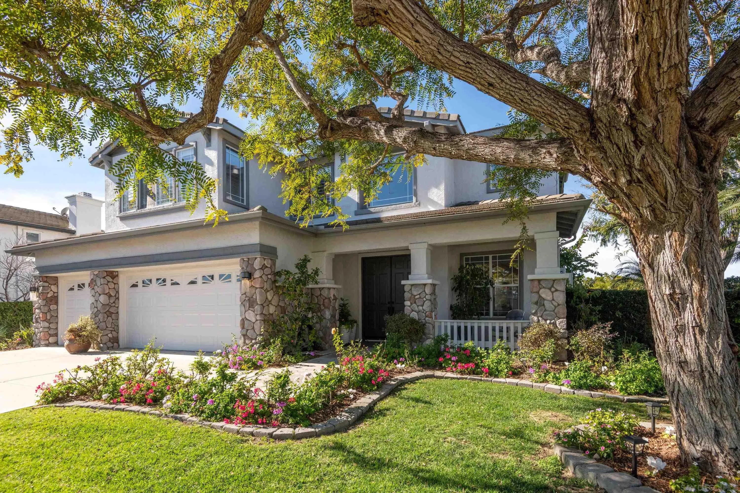 3476 Corte Sonrisa Carlsbad, CA 92009 - Photo 5 of 45 front view of a house with a yard