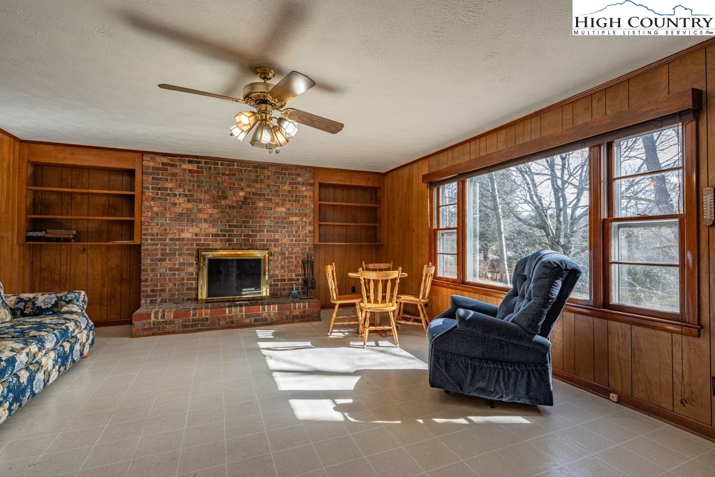 268 Farthing Street Boone, NC 28607 - Photo 15 of 30 a living room with furniture a fireplace and a flat screen tv