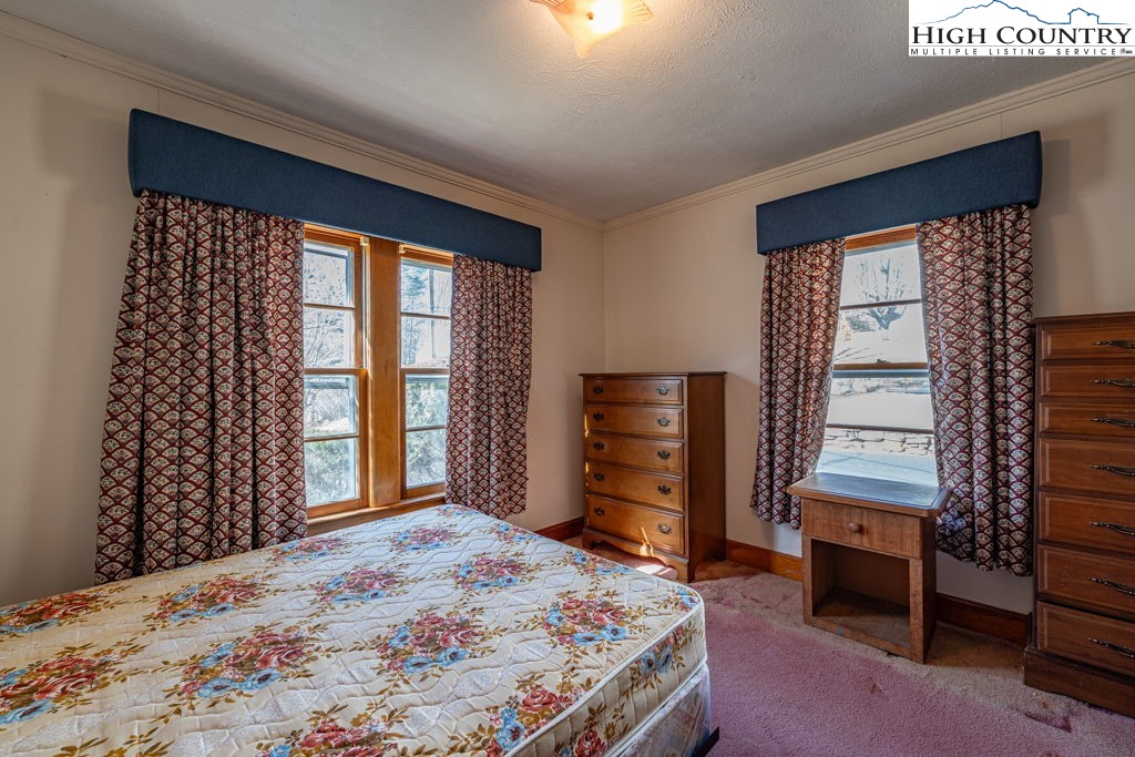 268 Farthing Street Boone, NC 28607 - Photo 21 of 30 a bedroom with a bed and a window