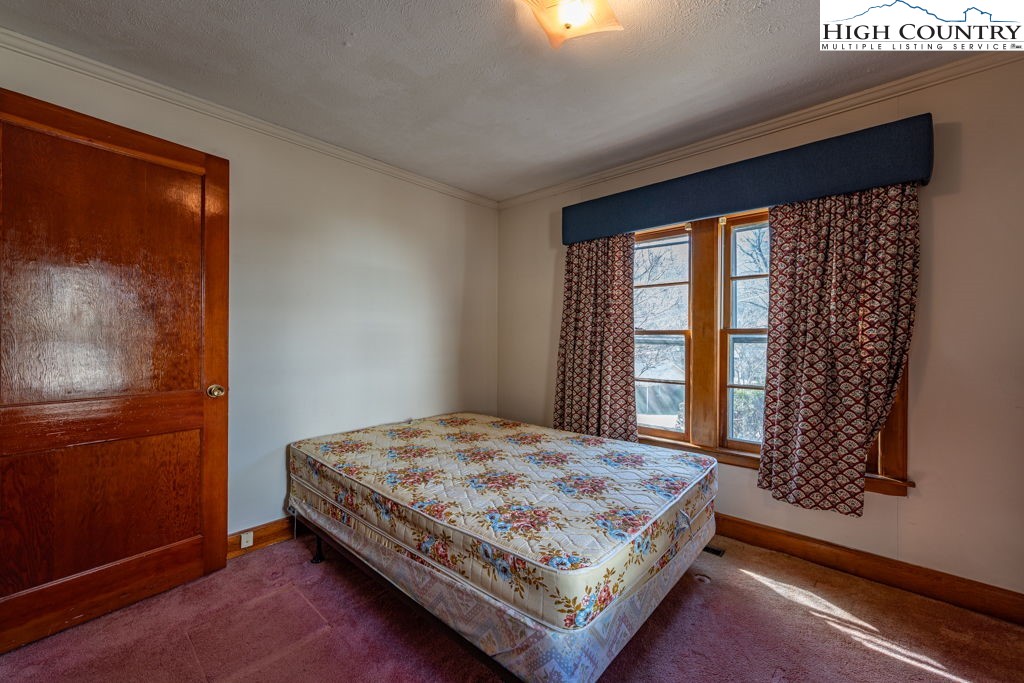 268 Farthing Street Boone, NC 28607 - Photo 22 of 30 a bedroom with a bed and a window