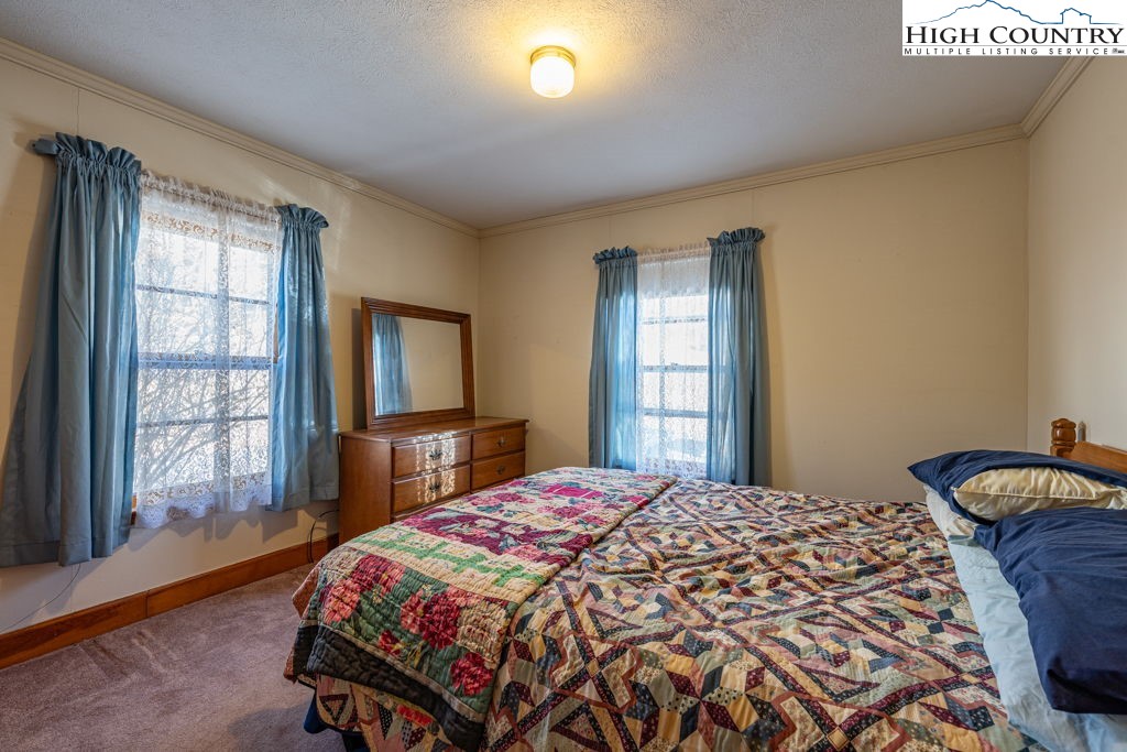 268 Farthing Street Boone, NC 28607 - Photo 24 of 30 a bedroom with a bed and a window
