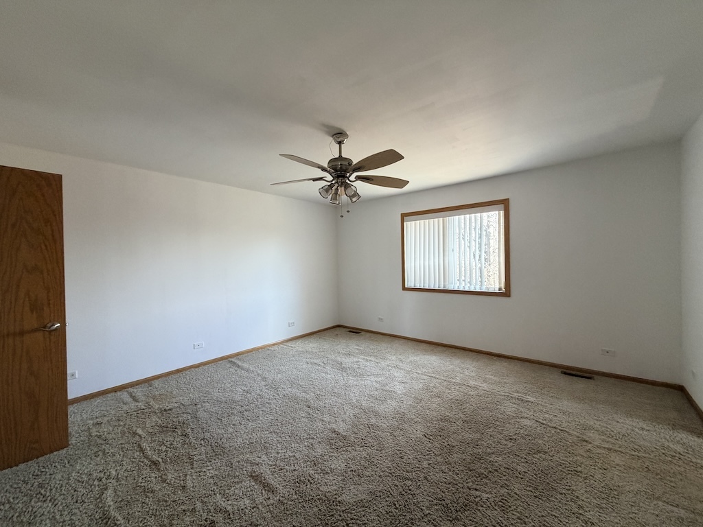 22503 State Street Steger, IL 60475 - Photo 11 of 20 an empty room with windows and fan