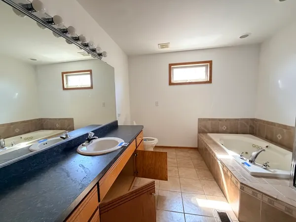 a bath room with a bed