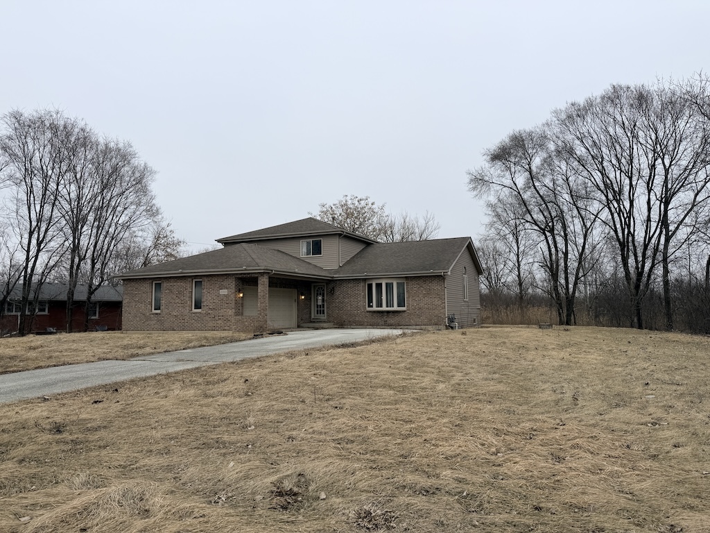 22503 State Street Steger, IL 60475 - Photo 16 of 20 a front view of a house with a yard