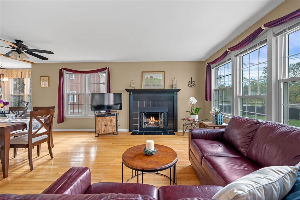33 Water Street, Unit 7 Danvers, MA 01923 - Photo 11 of 35 a living room with furniture a window and a fireplace