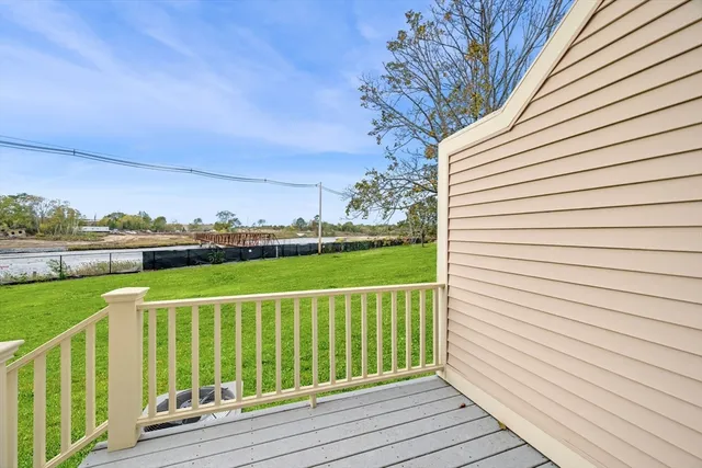 a view of a deck with a yard