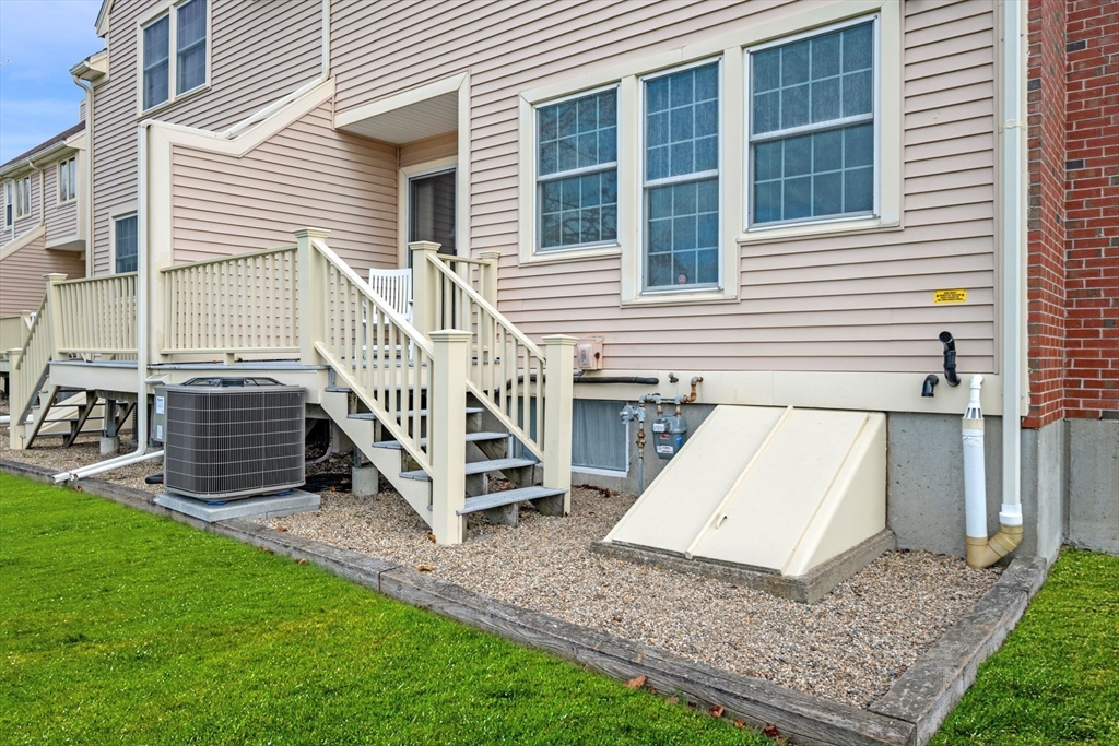 33 Water Street, Unit 7 Danvers, MA 01923 - Photo 18 of 35 a view of a house with a yard