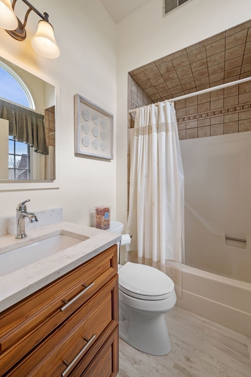 33 Water Street, Unit 7 Danvers, MA 01923 - Photo 22 of 35 a bathroom with a sink a toilet and shower