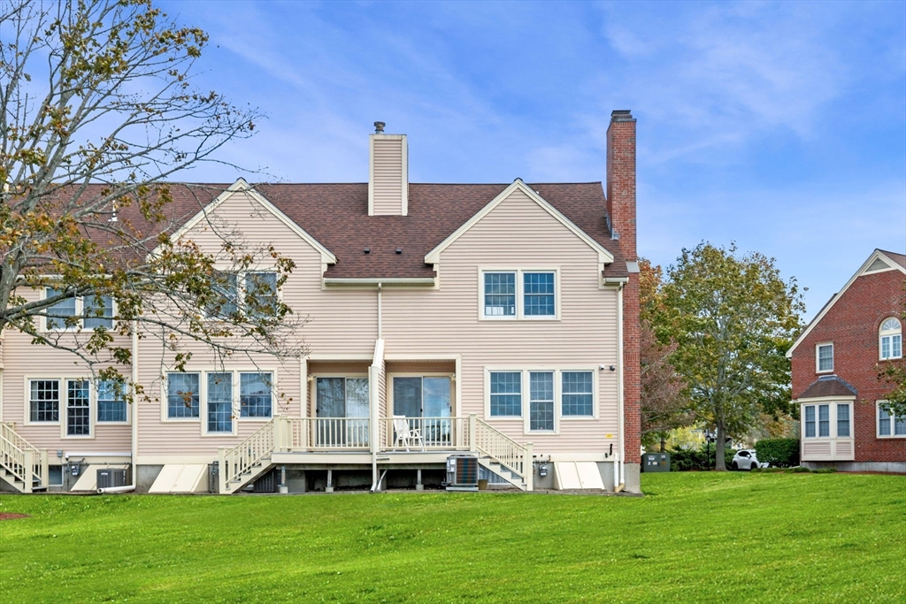 33 Water Street, Unit 7 Danvers, MA 01923 - Photo 23 of 35 a front view of a house with a yard