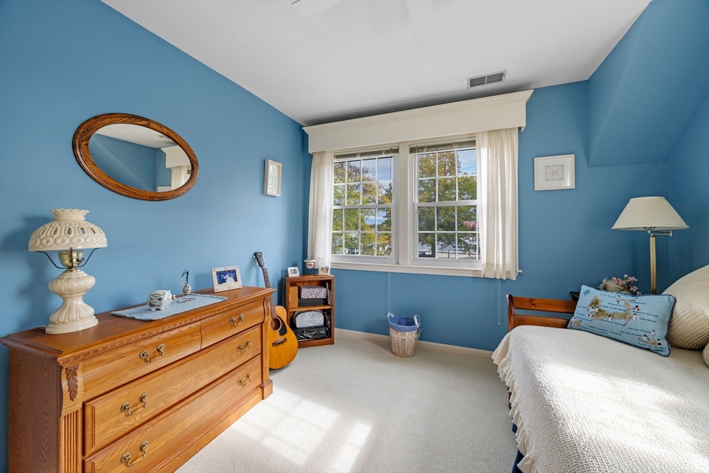 33 Water Street, Unit 7 Danvers, MA 01923 - Photo 29 of 35 a bedroom with a bed and a window