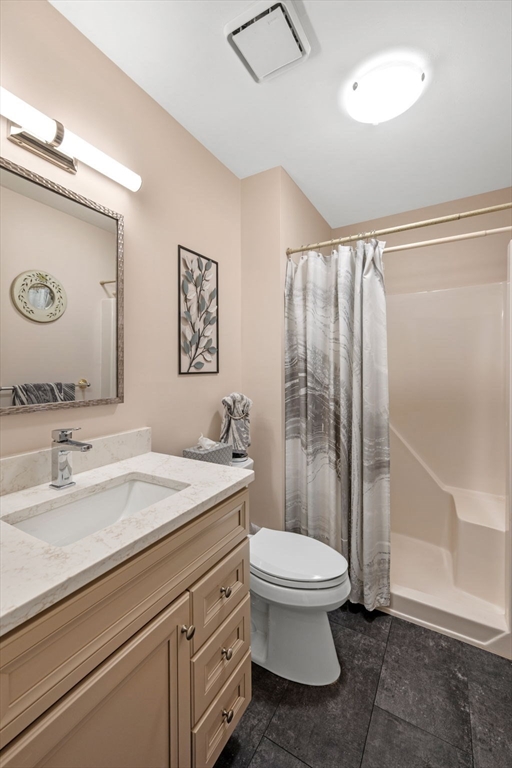 33 Water Street, Unit 7 Danvers, MA 01923 - Photo 30 of 35 a bathroom with a sink a toilet and shower