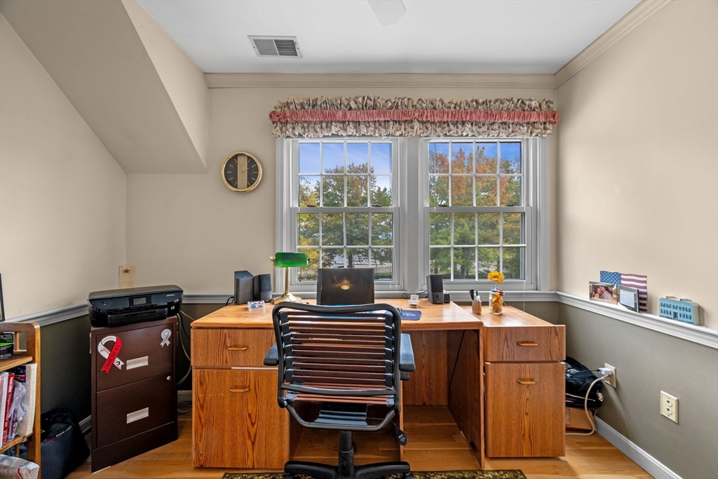 33 Water Street, Unit 7 Danvers, MA 01923 - Photo 31 of 35 a view of a workspace with furniture and a window