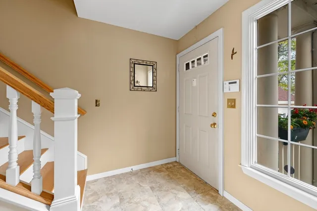 a view of an entryway with wooden floor