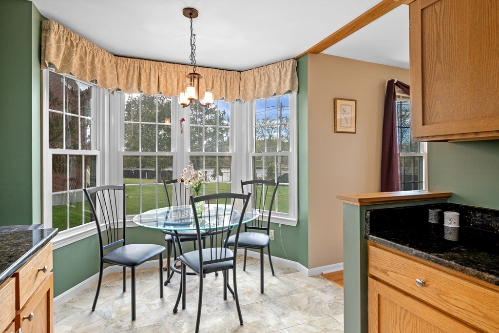 33 Water Street, Unit 7 Danvers, MA 01923 - Photo 7 of 35 a view of a dining room with furniture window and outside view