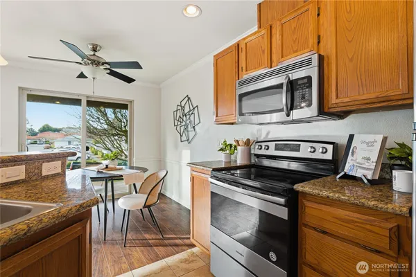 a kitchen with sink cabinets and window