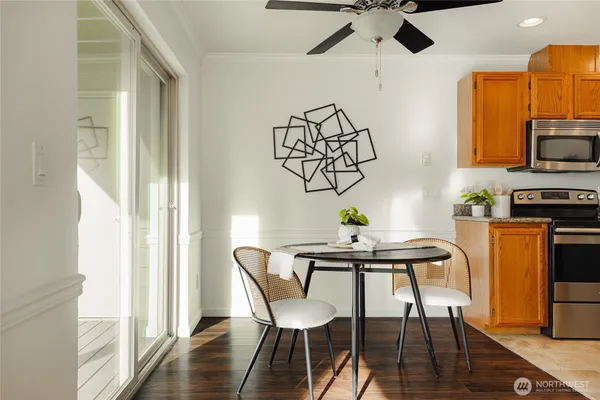 a view of a dining room with furniture window and wooden floor
