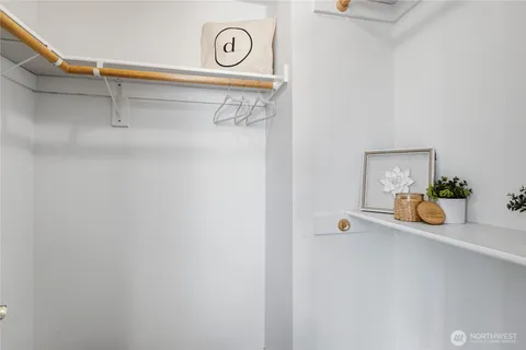 a bathroom with a granite countertop sink a toilet and a mirror