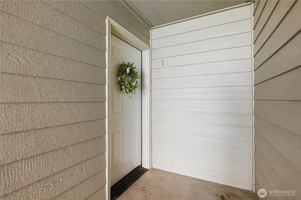 a picture of a hallway with wooden floor