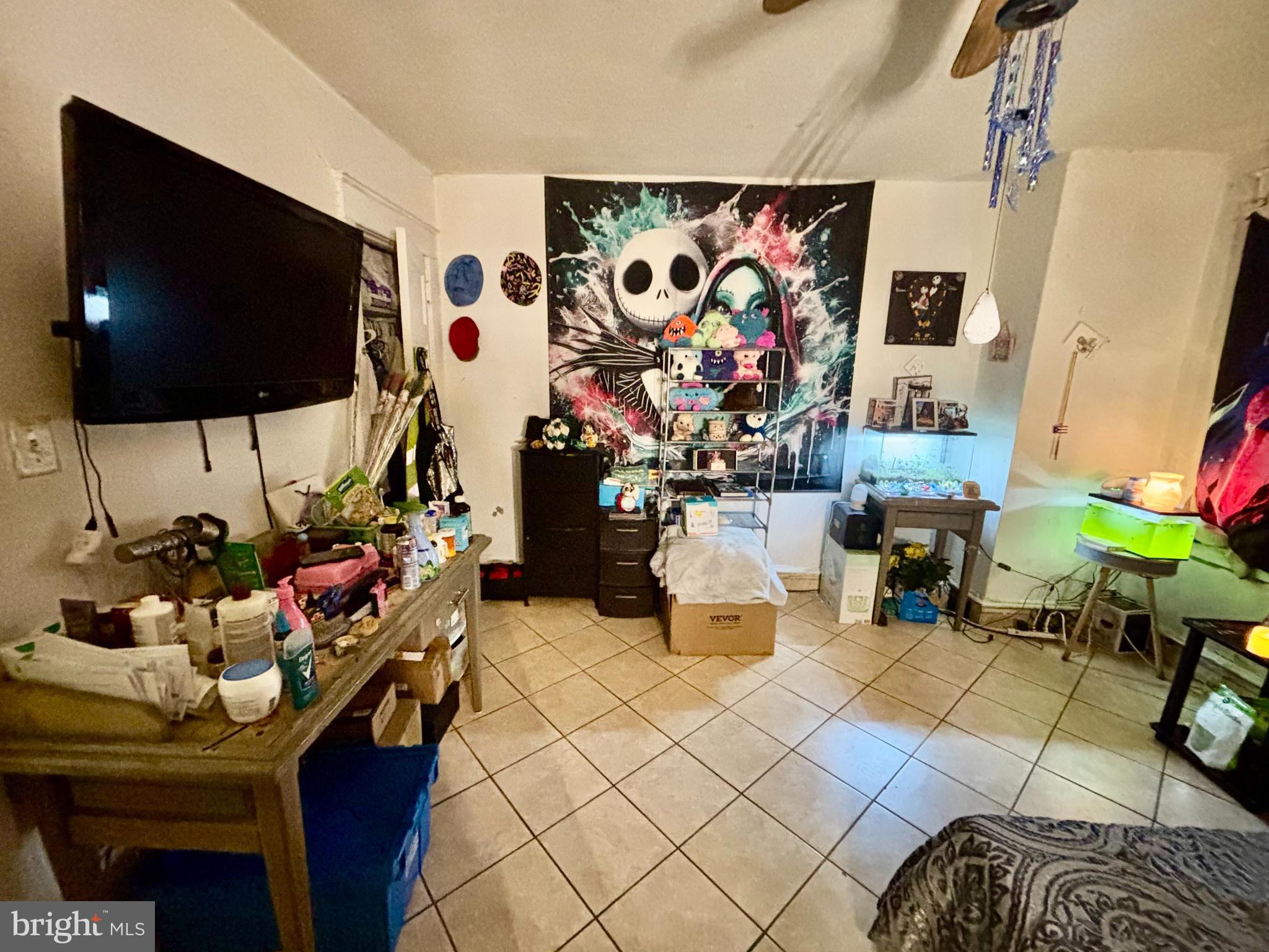 2535 Lindsay Street Chester, PA 19013 - Photo 12 of 22 a living room with furniture and a flat screen tv
