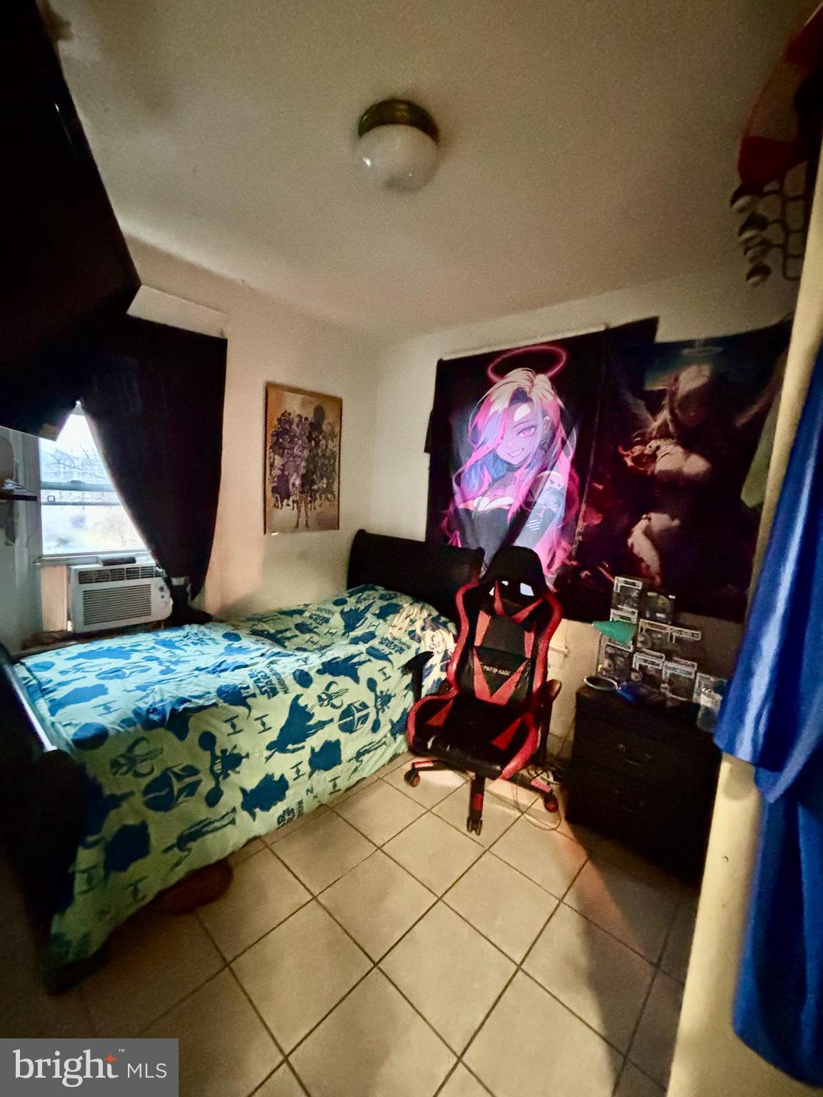 2535 Lindsay Street Chester, PA 19013 - Photo 18 of 22 a bedroom with a bed and dresser