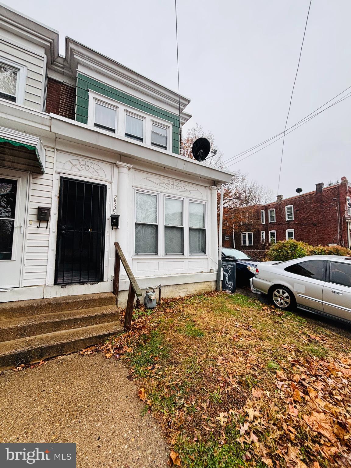 2535 Lindsay Street Chester, PA 19013 - Photo 2 of 22 a view of a house with a large window and wooden fence