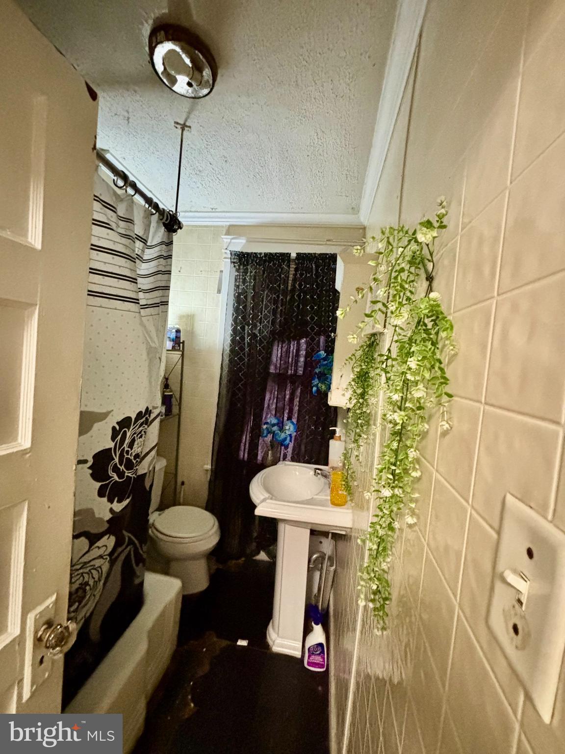 2535 Lindsay Street Chester, PA 19013 - Photo 22 of 22 a bathroom with a sink toilet and shower