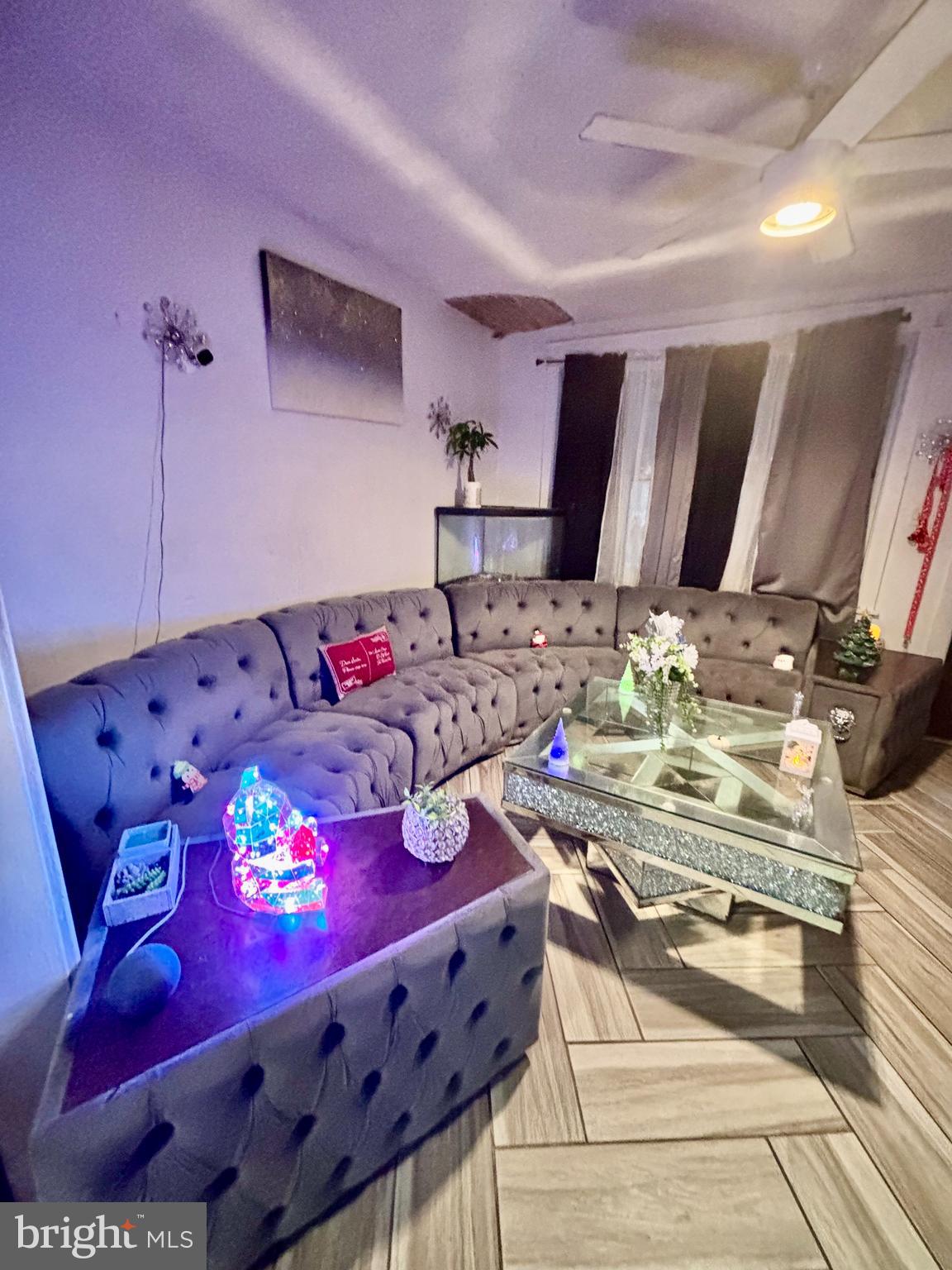 2535 Lindsay Street Chester, PA 19013 - Photo 5 of 22 a bed sitting in a bedroom next to a window