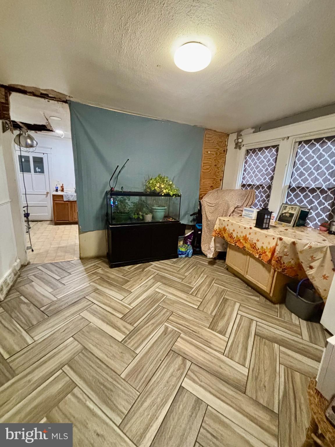 2535 Lindsay Street Chester, PA 19013 - Photo 8 of 22 a bedroom with a bed and a couch