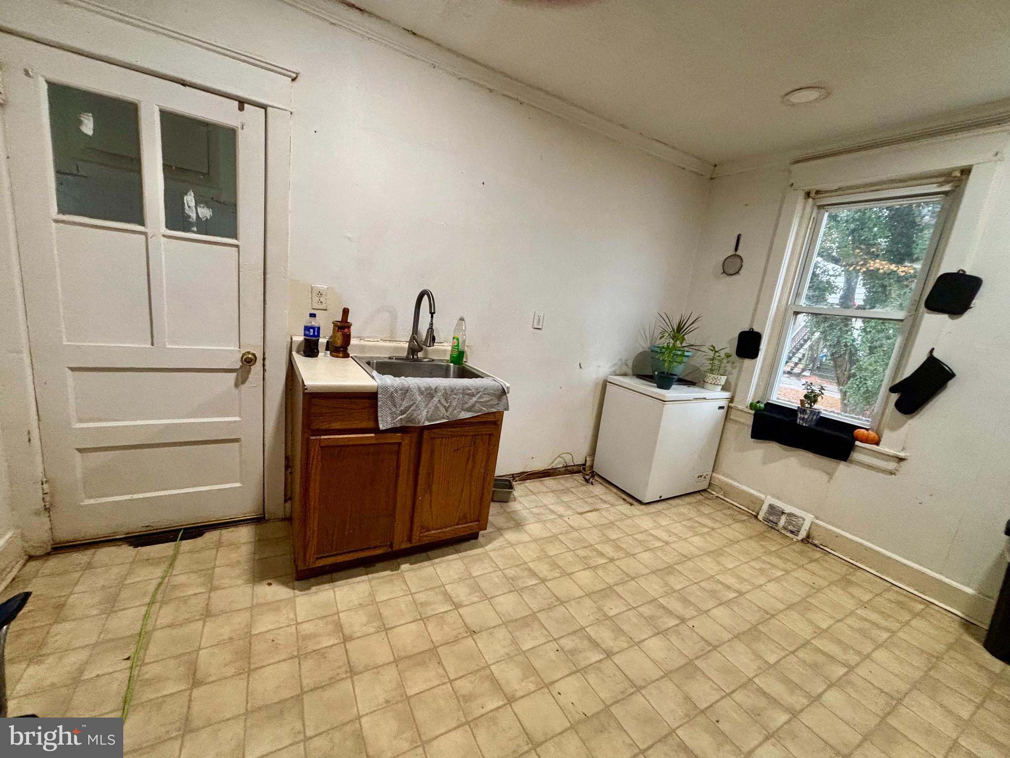 2535 Lindsay Street Chester, PA 19013 - Photo 10 of 22 a bedroom with a bed and a window