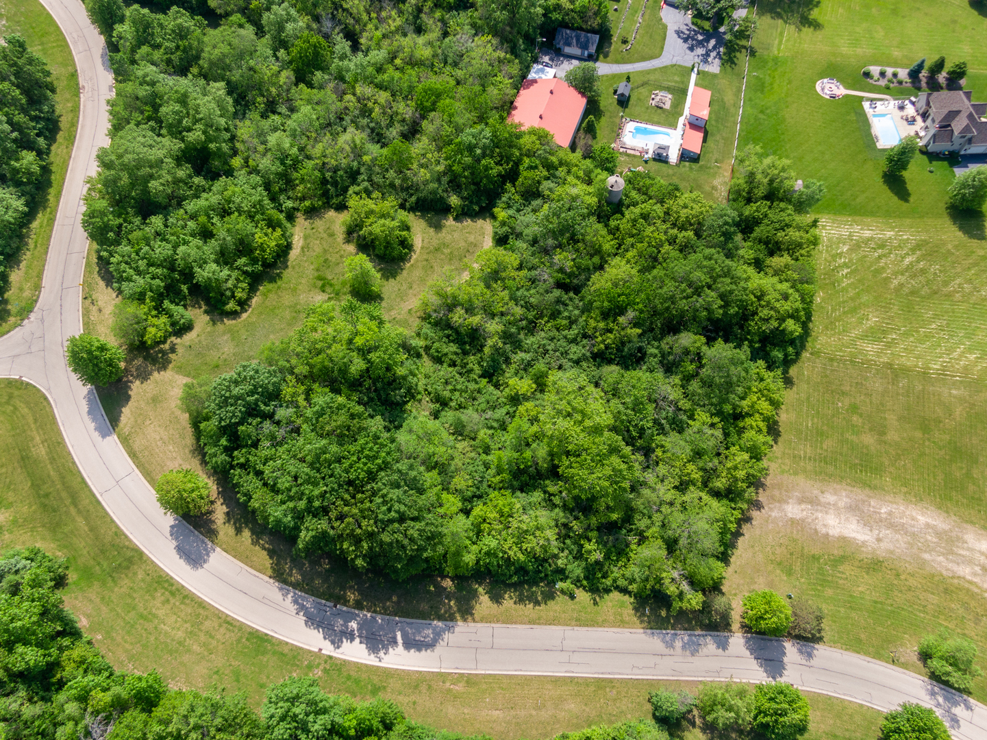 7393 English Oak Lane Spring Grove, IL 60081 - Photo 1 of 6 an aerial view of a house with lots of green space