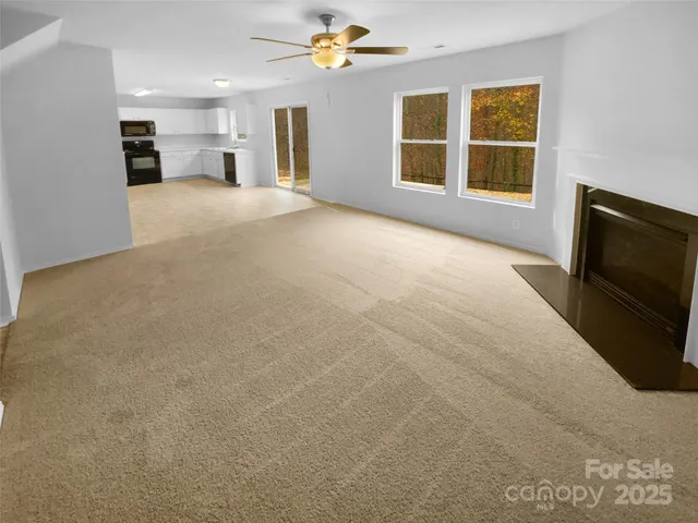 a view of a big room with carpet