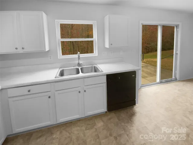 a kitchen with a sink and cabinets