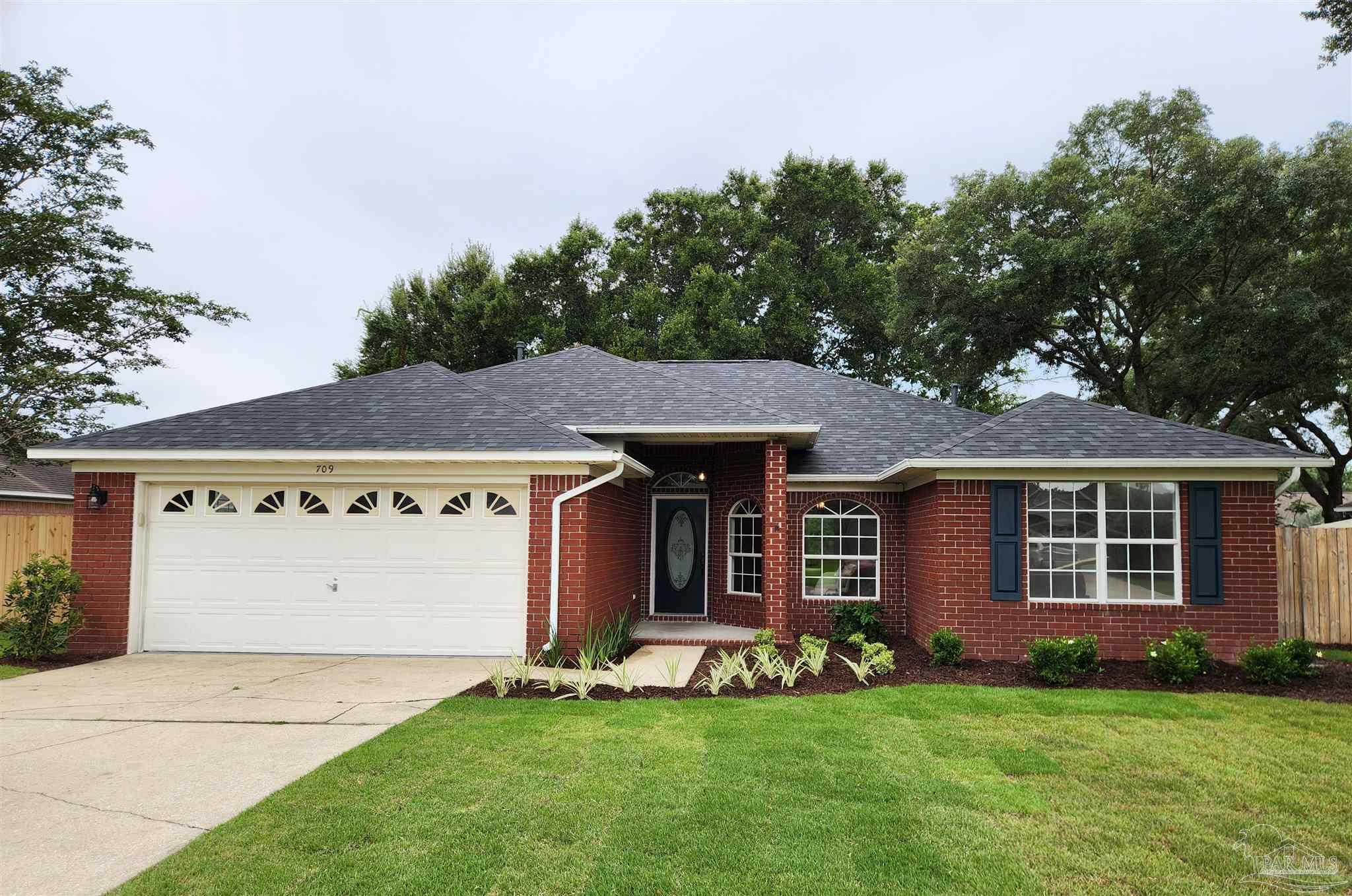 709 Jester Court Pensacola, FL 32506 - Photo 1 of 10 front view of a house with a yard