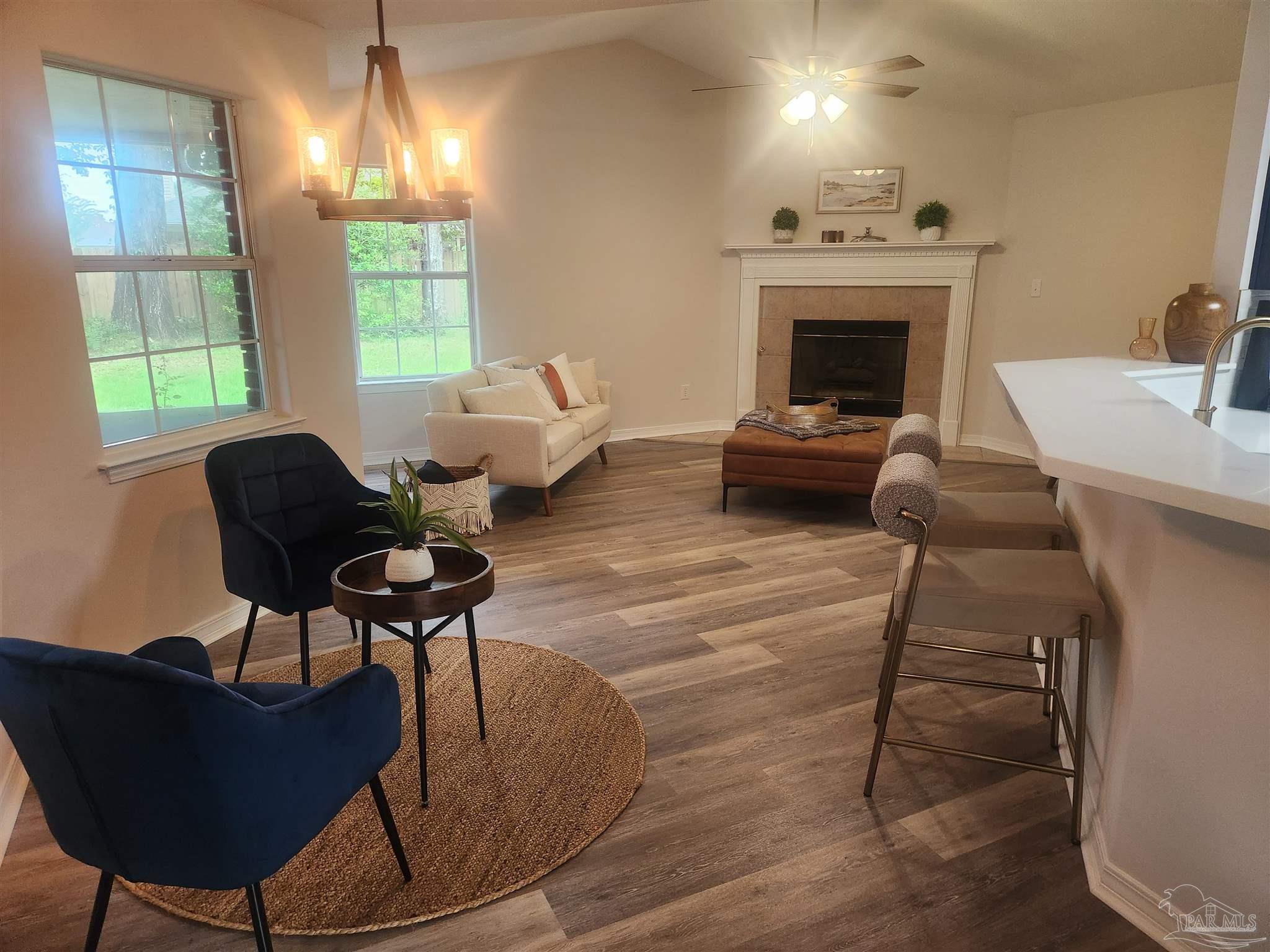 709 Jester Court Pensacola, FL 32506 - Photo 6 of 10 a living room with furniture and a fireplace