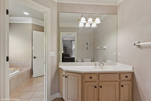 a bathroom with a sink double vanity and a mirror