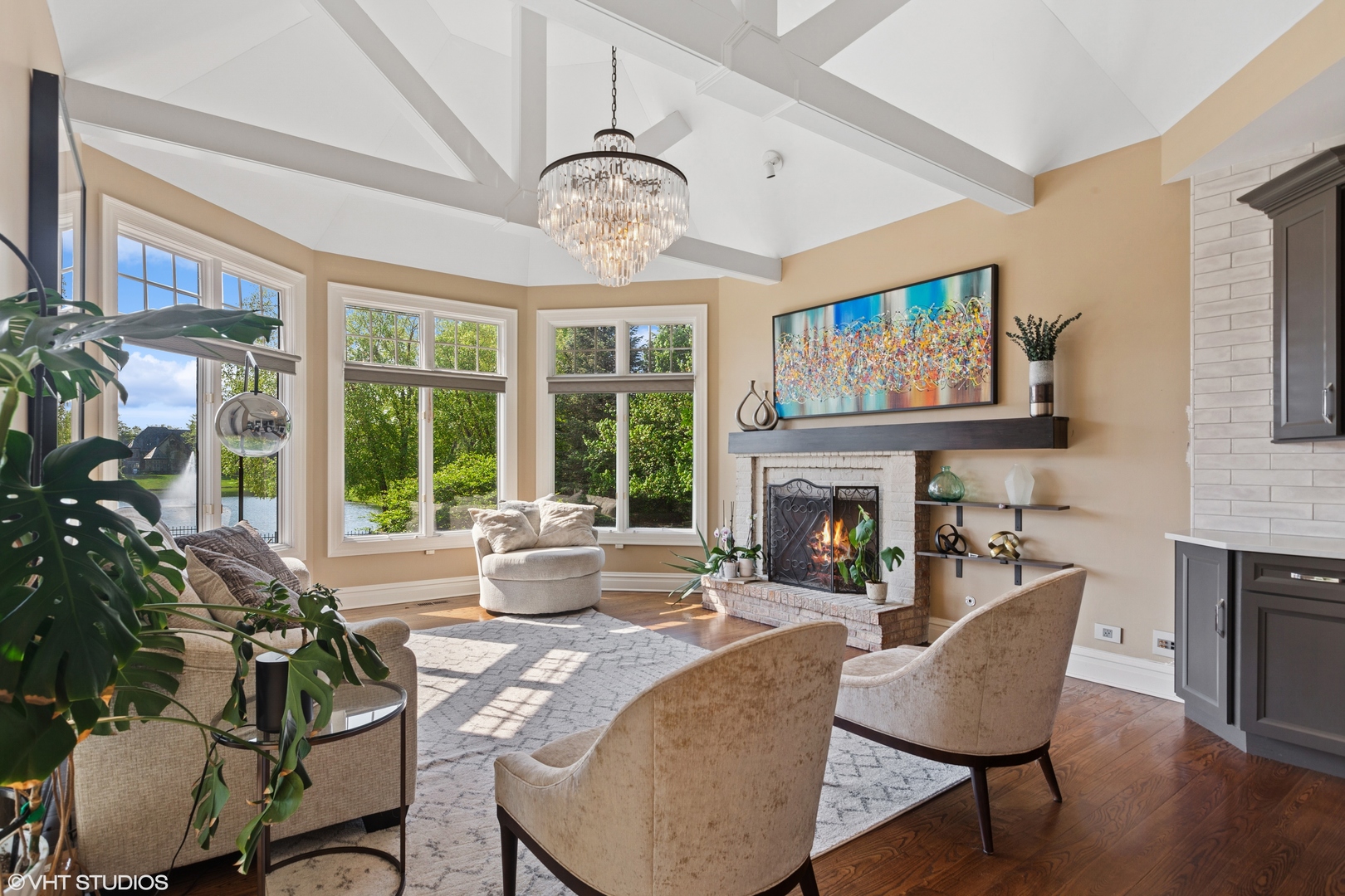 5N195 Dover Hill Road St. Charles, IL 60175 - Photo 9 of 42 a living room with furniture a fireplace and a large window
