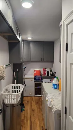 a kitchen with a sink a stove and cabinets