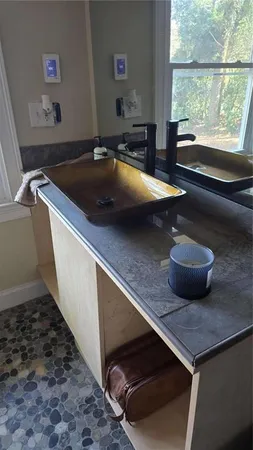 a room with a sink and a window