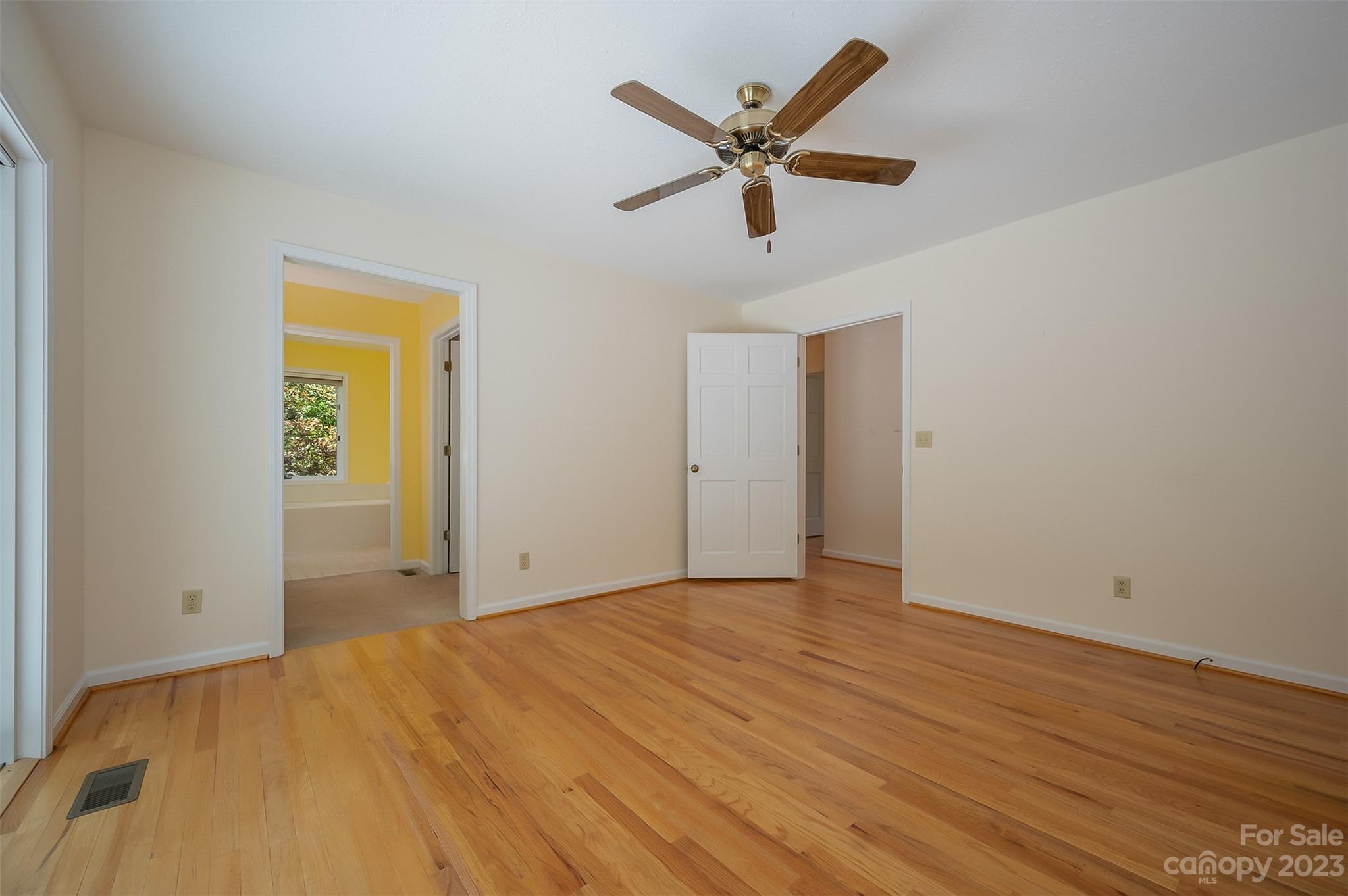 2236 Peniel Road Columbus, NC 28722 - Photo 34 of 48 a view of a livingroom with wooden floor and a ceiling fan