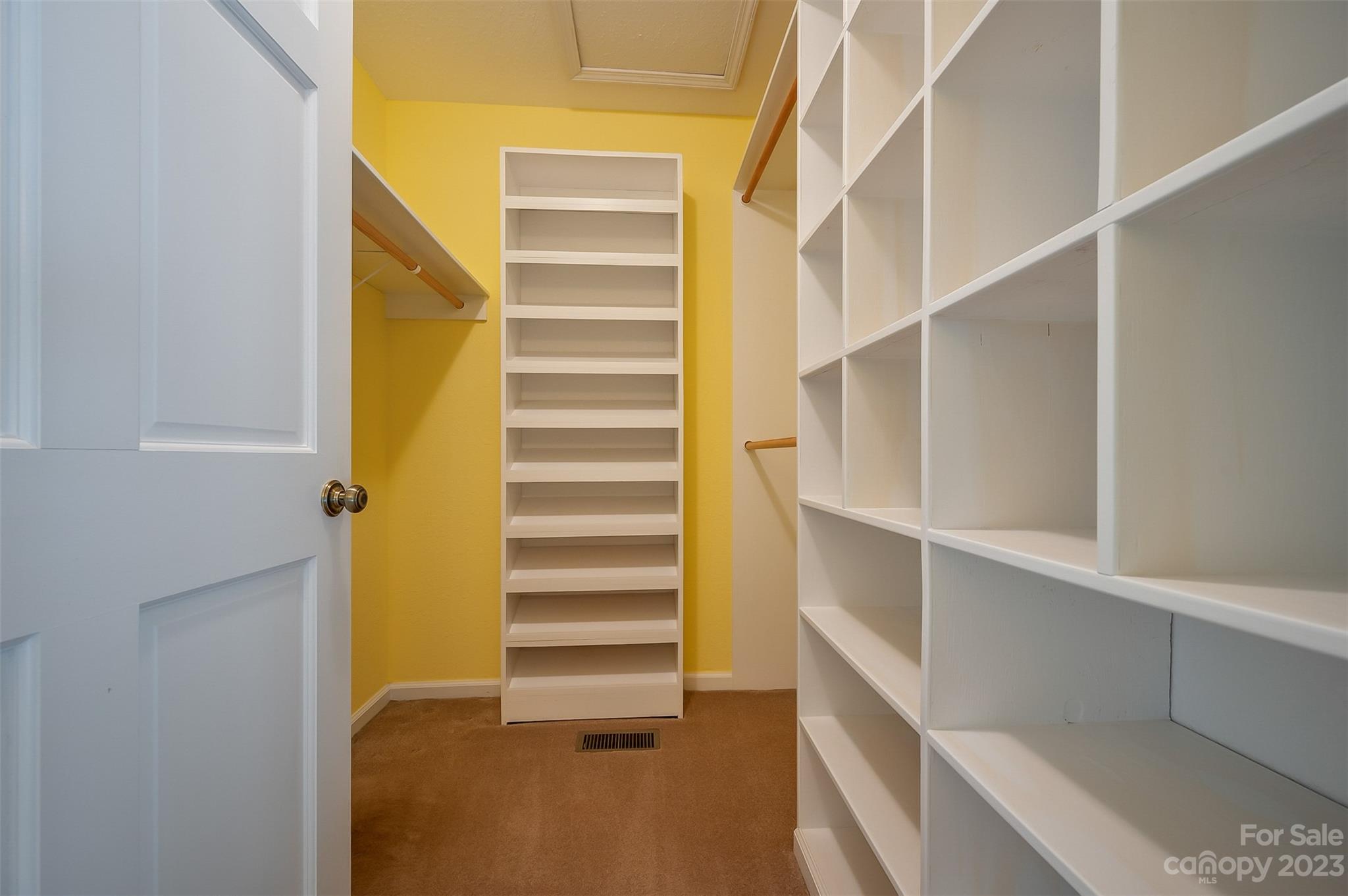 2236 Peniel Road Columbus, NC 28722 - Photo 36 of 48 a view of walk in closet with empty racks
