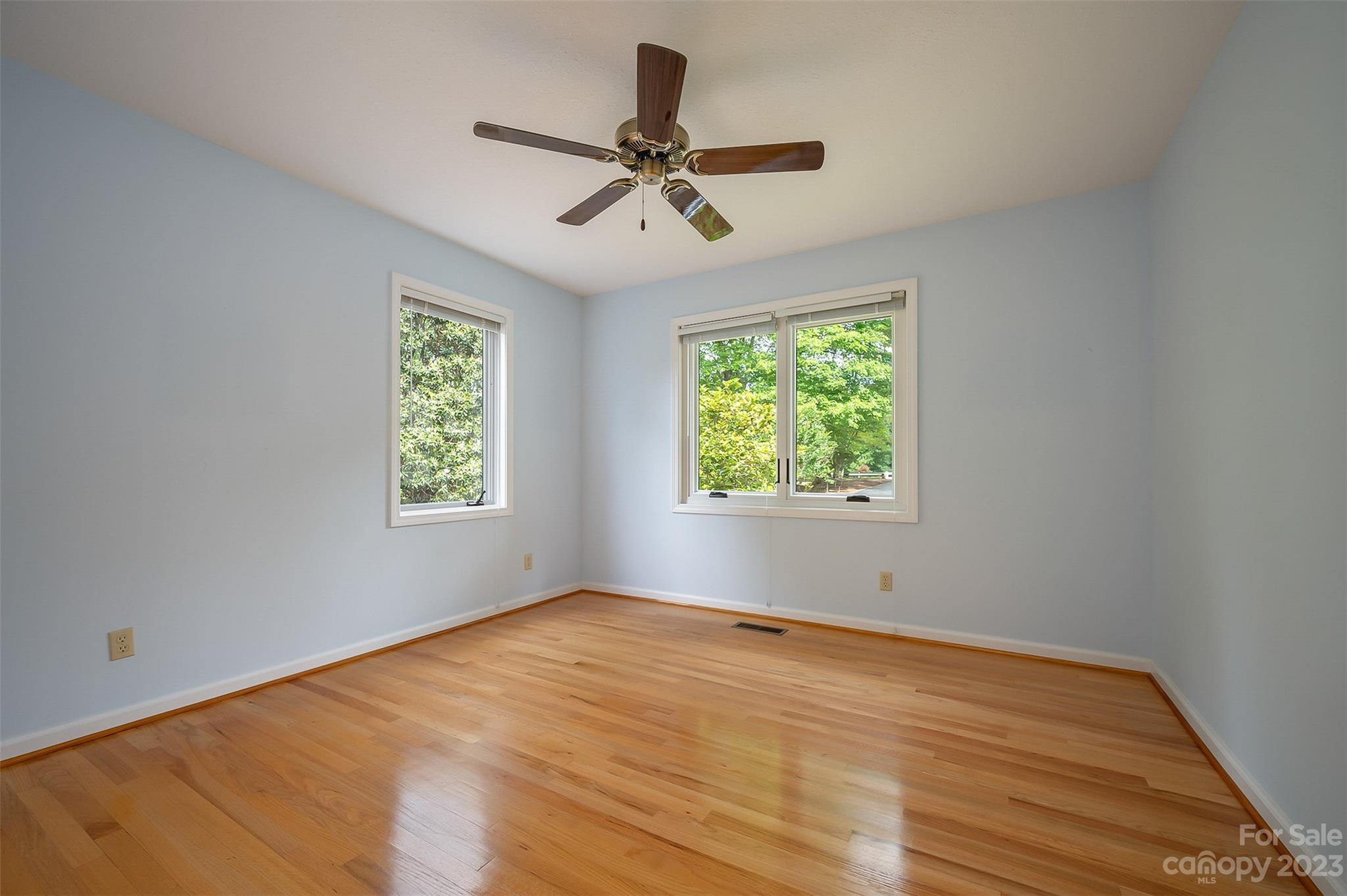 2236 Peniel Road Columbus, NC 28722 - Photo 41 of 48 wooden floor in an empty room with a window