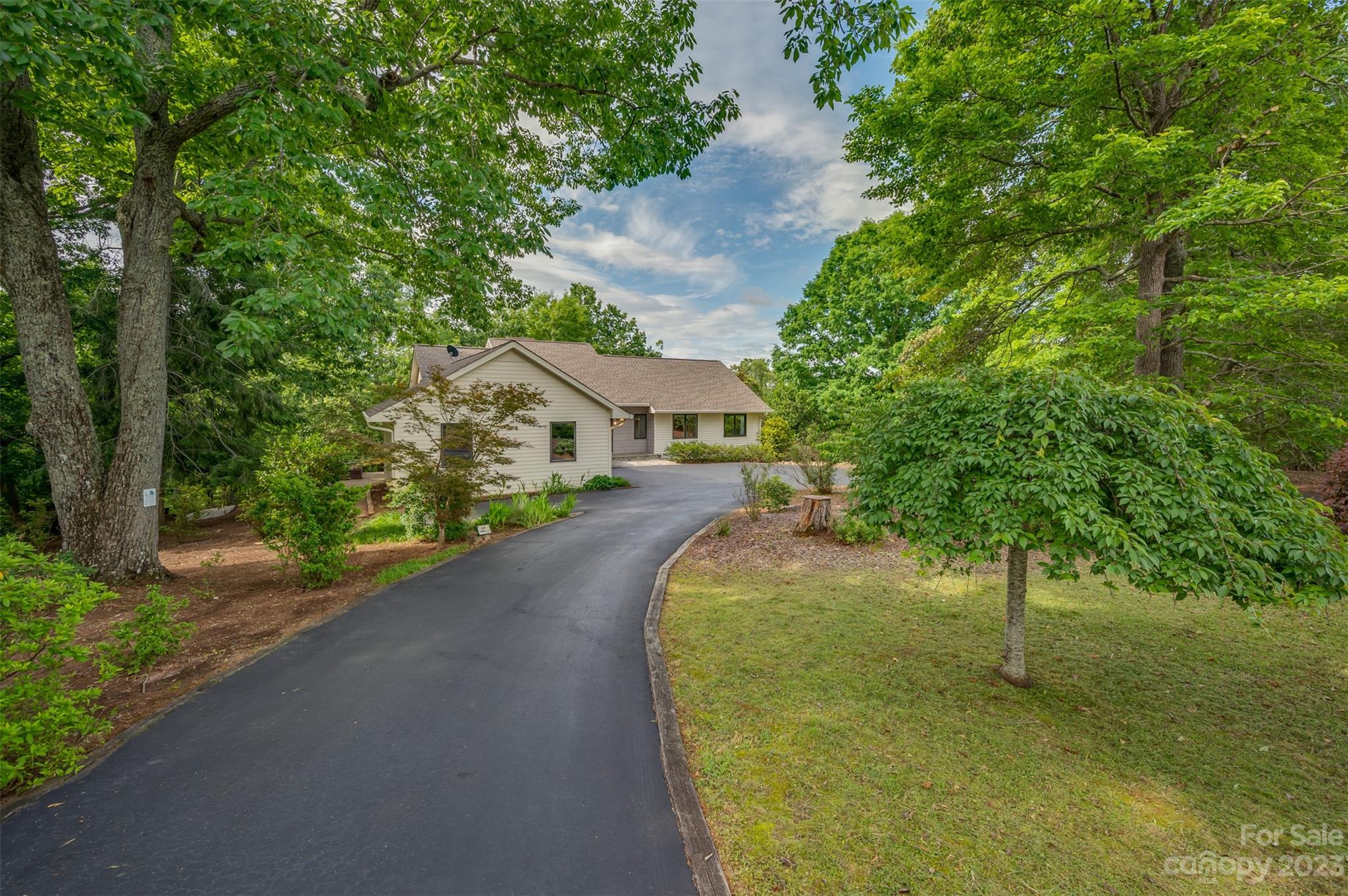 2236 Peniel Road Columbus, NC 28722 - Photo 5 of 48 a view of a house with a swimming pool