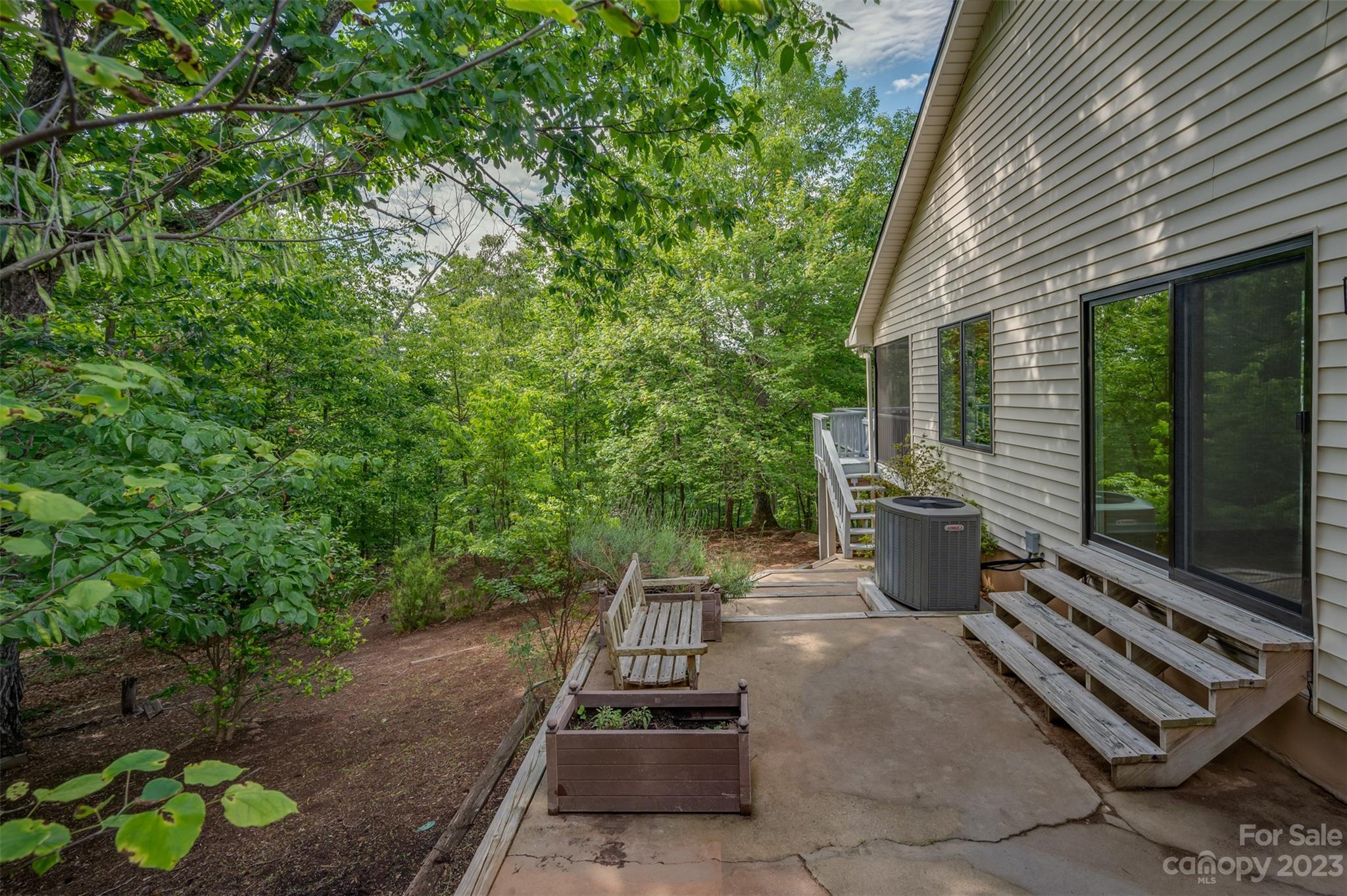 2236 Peniel Road Columbus, NC 28722 - Photo 8 of 48 a view of a patio with chairs and a potted plant