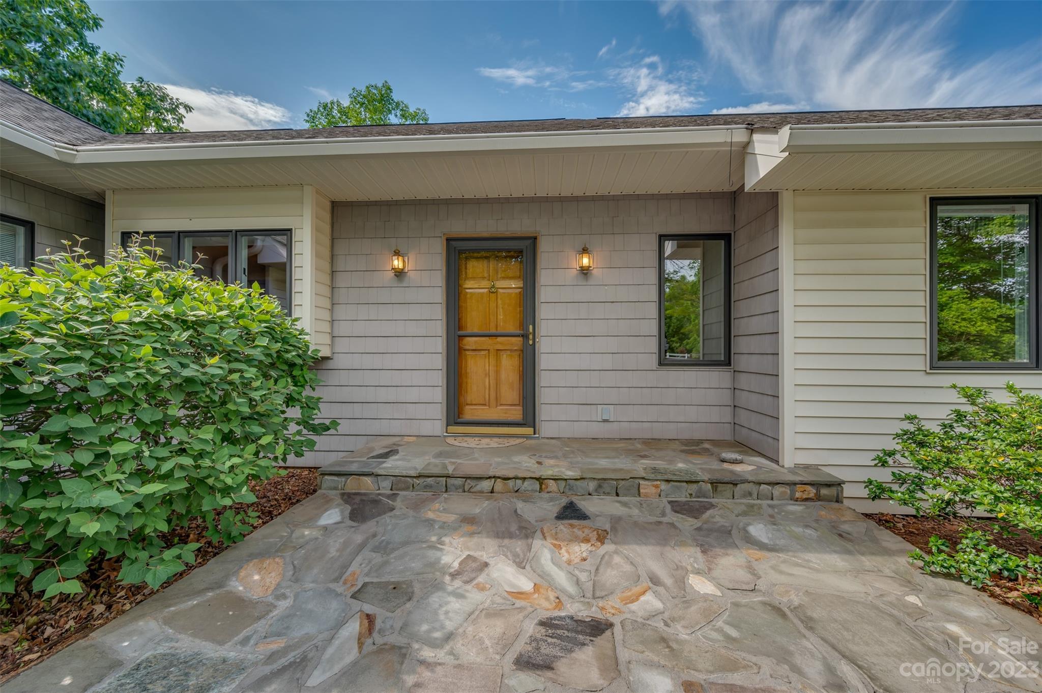 2236 Peniel Road Columbus, NC 28722 - Photo 10 of 48 a front view of a house with garden